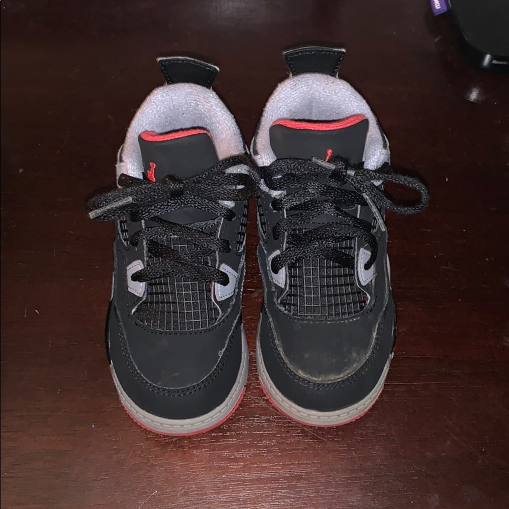 Black and grey Jordan retro 4